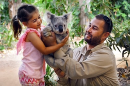 Child with a Koala at Currumbin Wildlife Sanctuary
